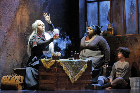 Judit Kutasi as Ulrica and chorister Sydnee Turrentine Johnson and supernumerary Atom Young Maguire in Verdi's "Un Ballo in Maschera." Photo: Cory Weaver/San Francisco Opera