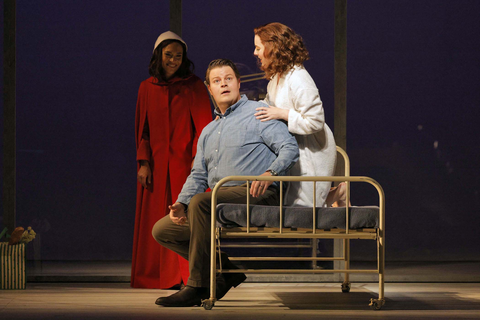 Christopher Oglesby as Luke, Simone McIntosh as Offred Double, and Irene Roberts (looking on) as Offred in Poul Ruders and Paul Bentley's "The Handmaid's Tale." Photo: Cory Weaver/San Francisco Opera