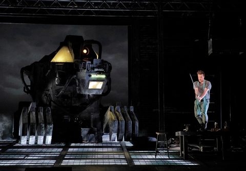 Daniel Brenna, as the title role of Wagner's "Siegfried," battles the dragon, Fafner. Photographer: Cory Weaver/San Francisco Opera.