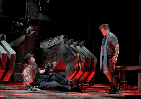 Daniel Brenna, as the title role of Wagner's "Siegfried," battles the dragon, Fafner (Raymond Aceto).  Photographer: Cory Weaver/San Francisco Opera.