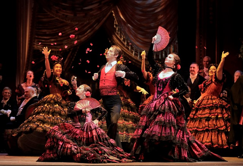 A scene from Verdi's "La Traviata" with dancers Lorena Feijóo, Bryan Ketron, and Blanche Hampton.  Photographer: Cory Weaver/San Francisco Opera.