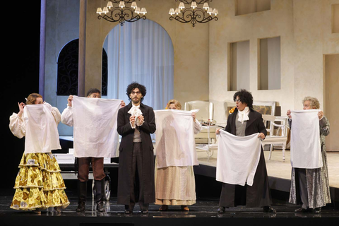 Riccardo Fassi (center) as Don Basilio in Rossini's "The Barber of Seville." Photo: Cory Weaver/San Francisco Opera