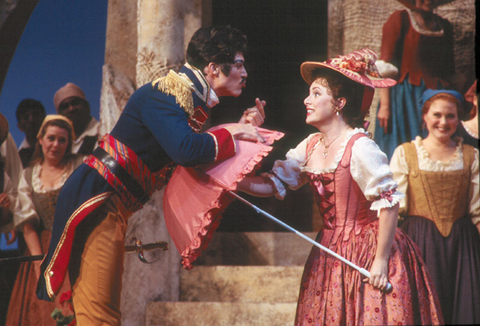 Rodney Gilfry (Belcore), Rebecca Evans (Adina), Chorus, L'Elisir d'Amore, Gaetano Donizetti. San Francisco Opera, 2000-01. Photographer: Ken Friedman/San Francisco Opera.