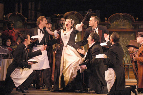 Dina Kuznetsova (Musetta), Ensemble, La Bohème, Giacomo Pucinni. San Francisco Opera, 2003-04. Photographer: Larry Merkle/San Francisco Opera.