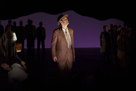 Gerald Finley (J. Robert Oppenheimer), Chorus, Doctor Atomic, John Adams. San Francisco Opera, 2005-06. Photographer: Terrence McCarthy/San Francisco Opera.