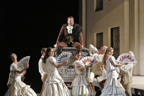 Lucas Meachem (Figaro), Ballet, Il Barbiere di Siviglia, Gioachino Rossini. San Francisco Opera, 2013-14. Photographer: Cory Weaver/San Francisco Opera.