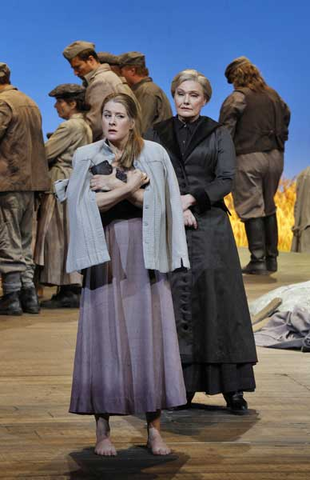 Malin Byström (Jenůfa), Karita Mattila (Kostelnička Buryjovka), Chorus, Jenůfa, Leoš Janáček. San Francisco Opera, 2015-16. Photographer: Cory Weaver/San Francisco Opera.