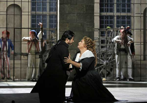 Yonghoon Lee (Andrea Chénier), Anna Pirozzi (Maddalena di Coigny), Supernumeraries, Andrea Chénier, Umberto Giordano. San Francisco Opera, 2016-17. Photographer: Cory Weaver/San Francisco Opera.