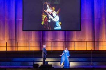 San Francisco Opera's "100th Anniversary Concert" with Christian Van Horn and Heidi Stober performing a duet from Mozart's "Don Giovanni" below an archival San Francisco Opera image (Ljuba Kazarnovskaya and Frederica von Stade in Mozart's "La Clemenza di Tito," 1993). Photo: Drew Altizer Photography