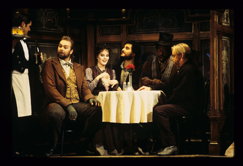 Supernumerary, David Okerlund (Schaunard), Mary Mills (Mimì), Roberto Aronica (Rodolfo), Cester Patton (Colline), Victor Ledbetter (Marcello), La Bohème, Giacomo Puccini. San Francisco Opera, 1995-96. Photographer: Marty Sohl/San Francisco Opera.