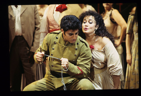 José Cura (Don José), Olga Borodina (Carmen), Chorus, Carmen, Georges Bizet. San Francisco Opera, 1996-97. Photographer: Marty Sohl/San Francisco Opera.