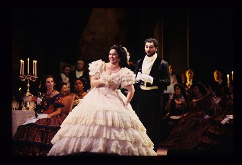 Roberto Aronica (Alfredo), Verónica Villarroel (Violetta), Chorus, La Traviata, Giuseppe Verdi. San Francisco Opera, 1995-96. Photographer: Marty Sohl/San Francisco Opera.