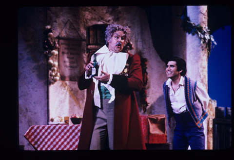 John Del Carlo (Dr. Dulcamara), Luis Lima (Nemorino), L'Elisir d'Amore, Gaetano Donizetti. San Francisco Opera, 1984-85. Photographer: Ron Scherl/San Francisco Opera.