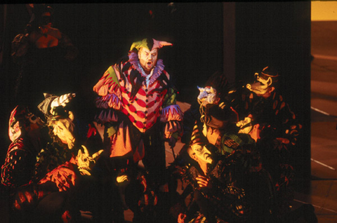 Stephan Pyatnychko (Rigoletto), Chorus, Rigoletto, Giuseppe Verdi. San Francisco Opera, 2001-02. Photographer: Ken Friedman/San Francisco Opera.